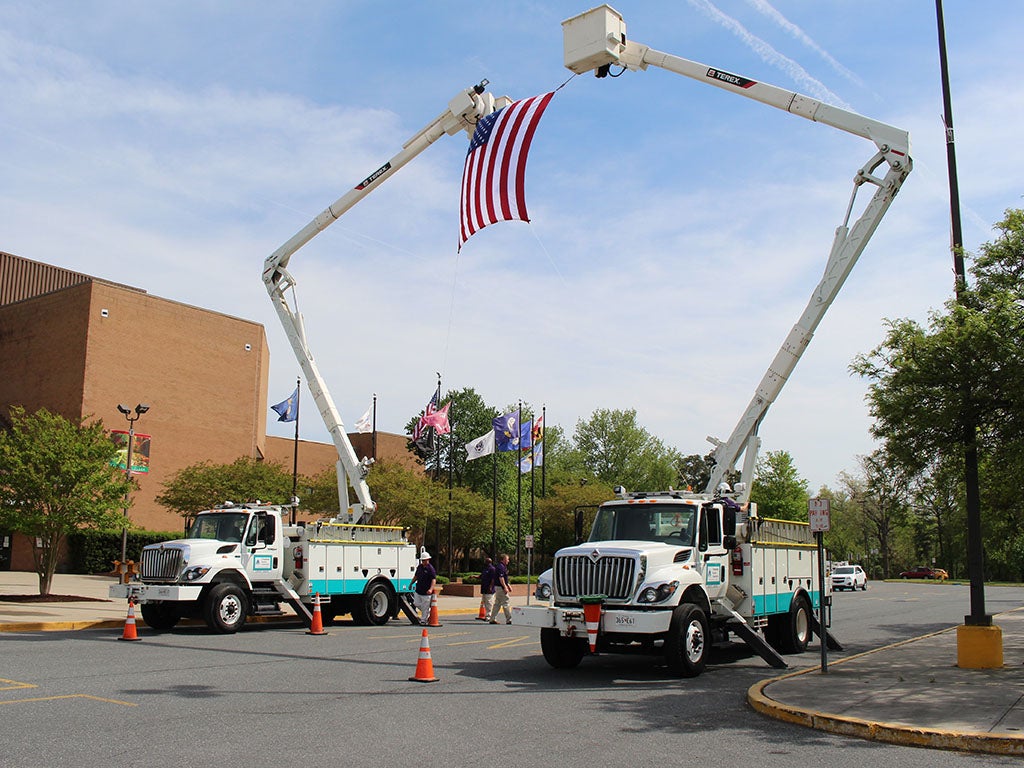 Annual Meeting Trucks with Flag