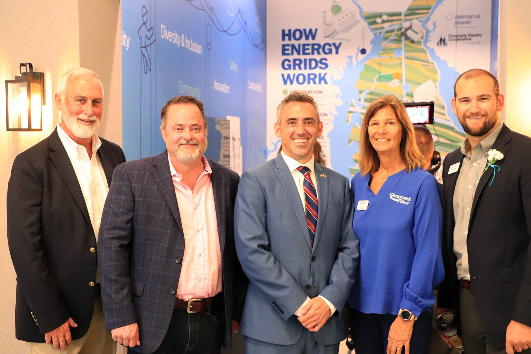 (L-R) Board Member Jeff Rathell, CEO & President Mike Malandro, Maryland Secretary of Housing Jake Day, Board Member Donna West, and Matthew Teffeau stand in front of our new utility storefront
