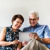 COUPLE LOOKING AT GOOD NEWS
